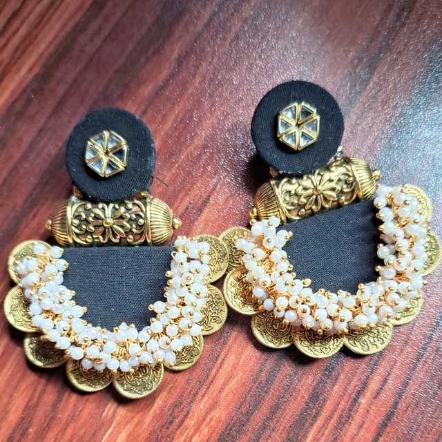 Traditional gold-toned earrings with black fabric, pearl beads, floral and coin accents