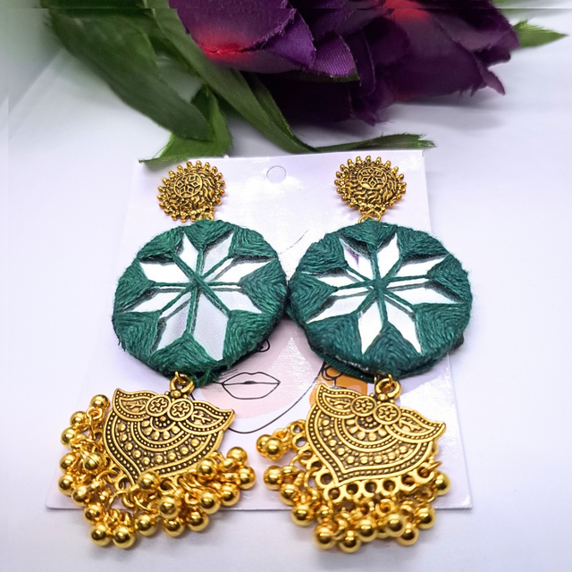 Green mirror work earrings with gold plated jhumka, floral and geometric design, on display card