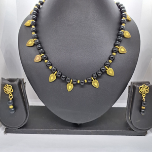 Black Beads and Golden Cham Necklace